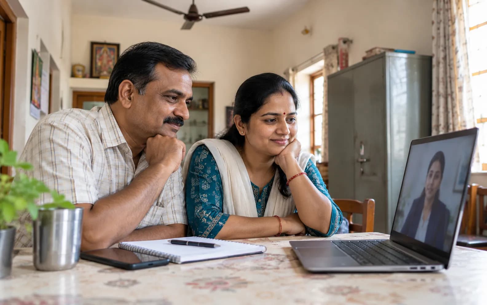 Couple in a small-town home consulting a loan settlement legal expert online